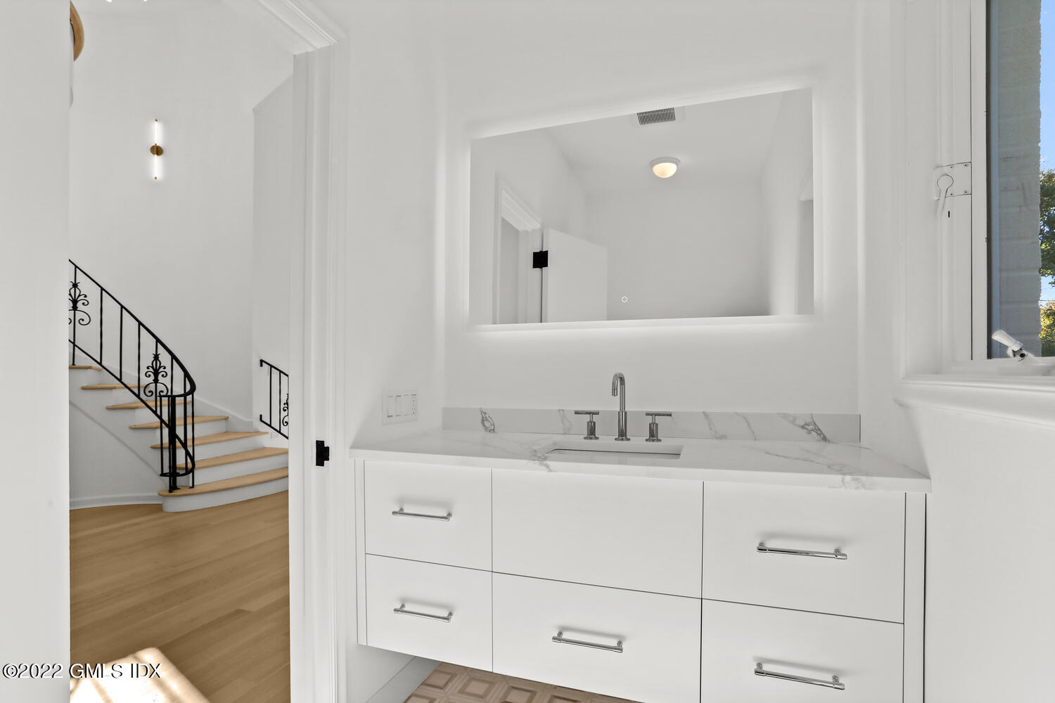 10 Harkim Road Greenwich, CT 06831 - Photo 10 of 39 a bathroom with a sink and a mirror