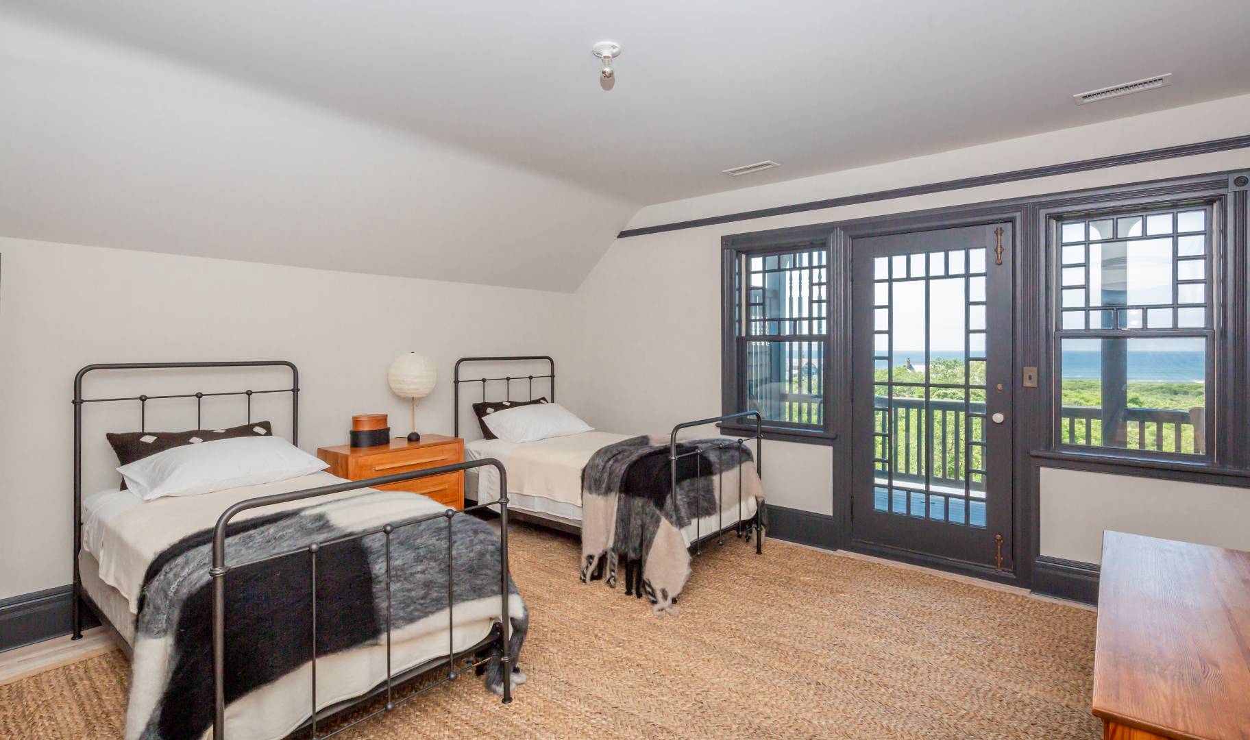 153 Deforest Road Montauk, NY 11954 - Photo 15 of 23 a bedroom with two beds and a window