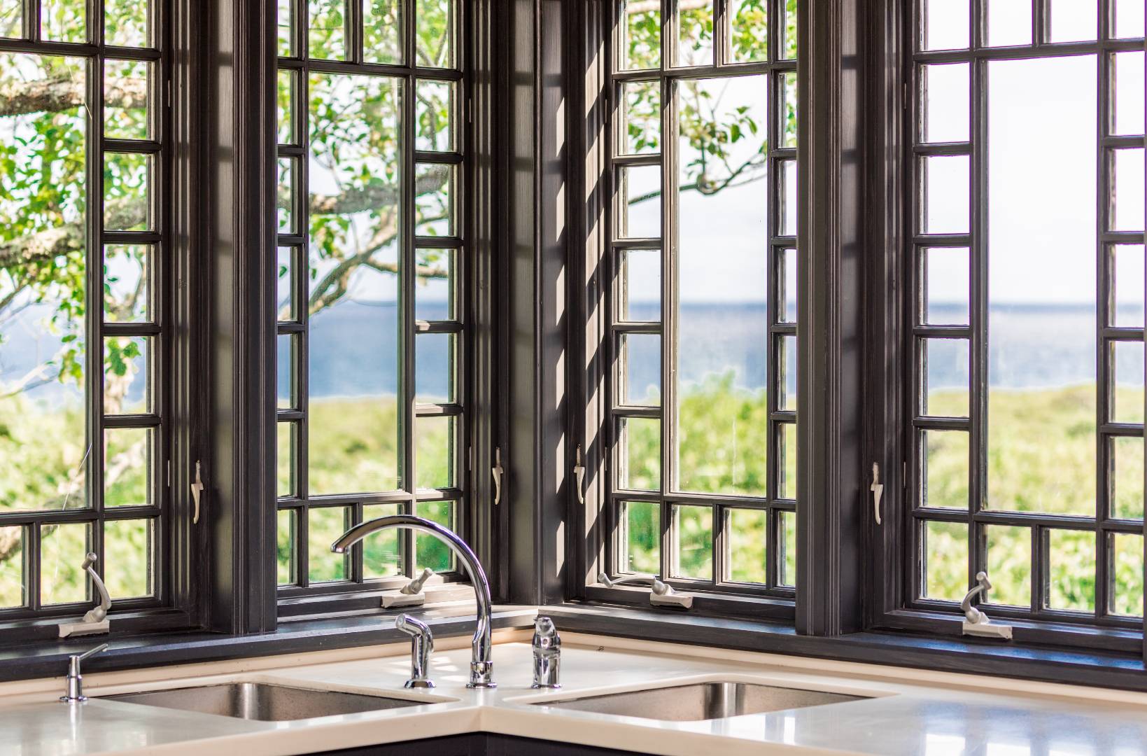 153 Deforest Road Montauk, NY 11954 - Photo 5 of 23 a view of living room with large windows and plants