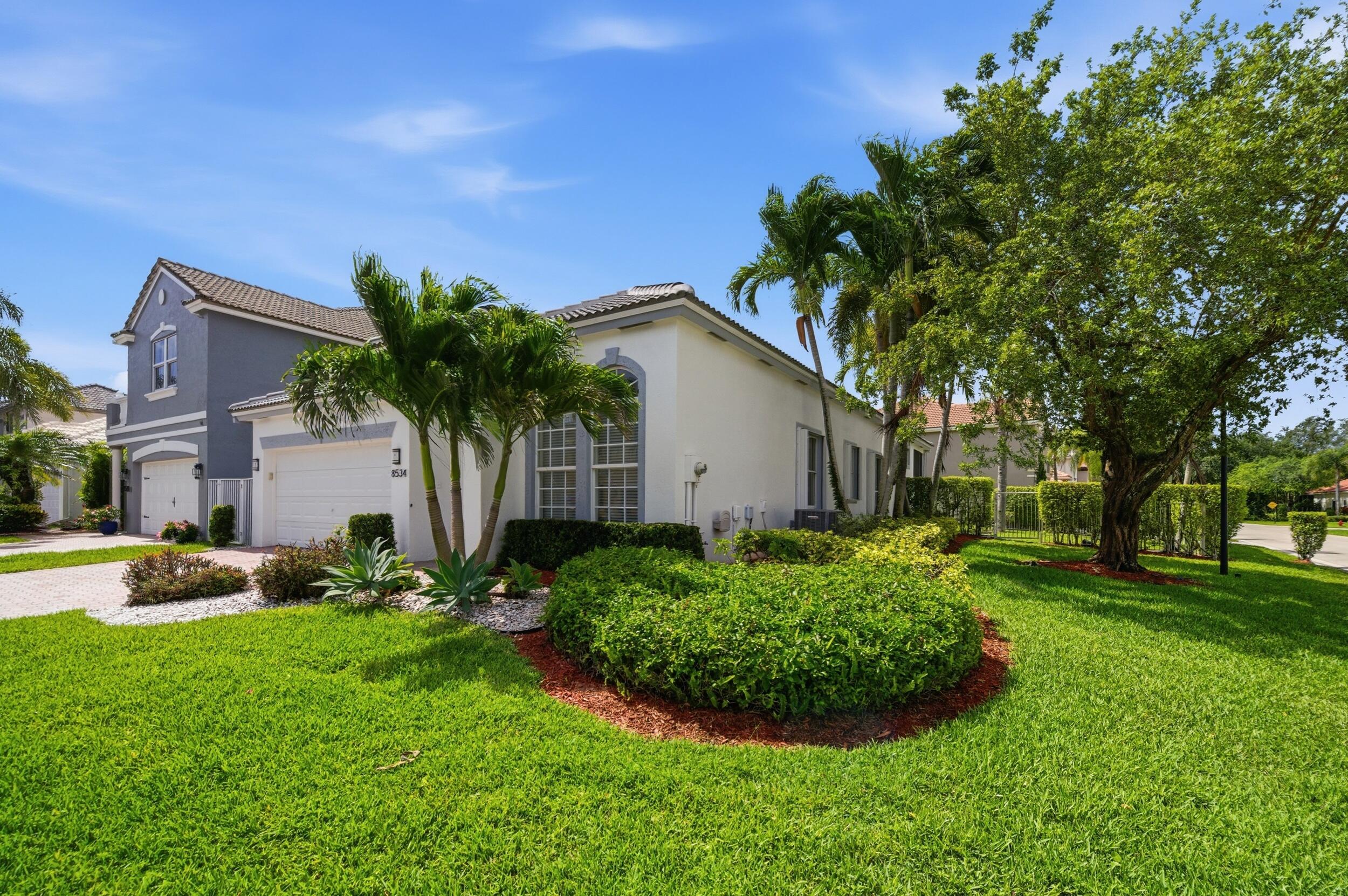 8534 Vía D Oro Boca Raton, FL 33433 - Photo 31 of 34 a view of a house with backyard and garden