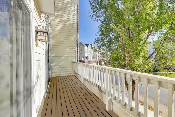 a view of a balcony with wooden floor