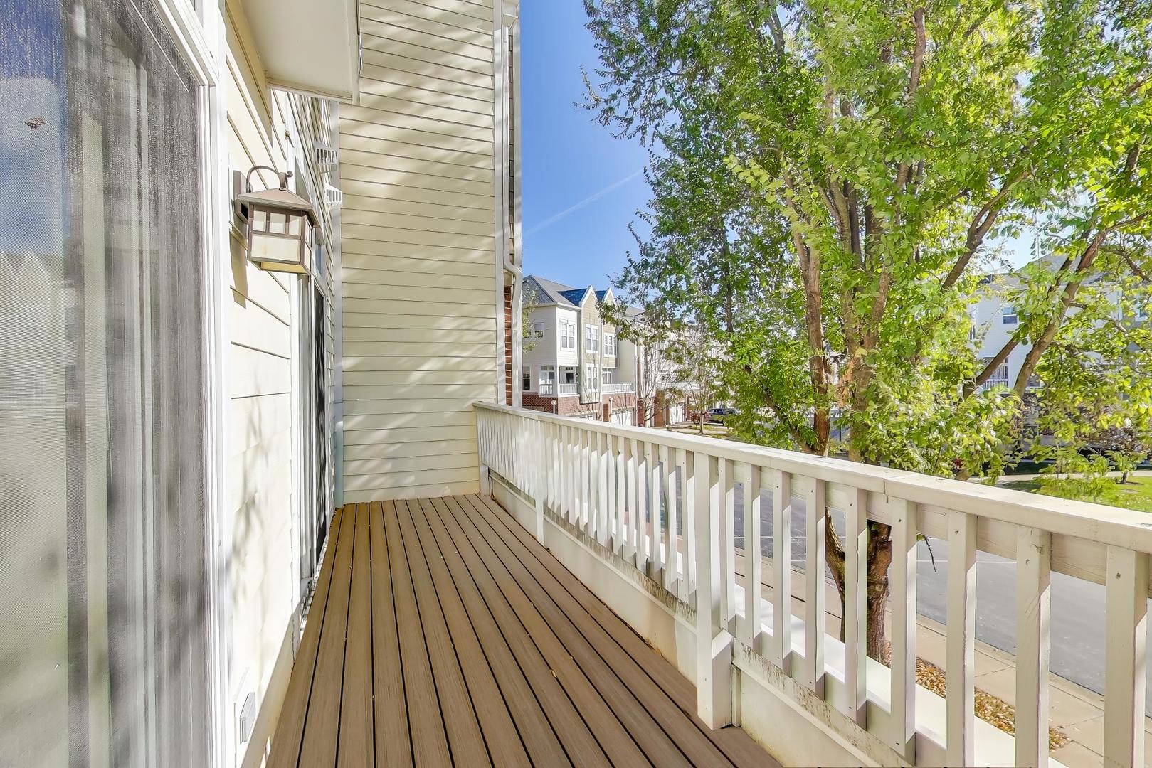 513 Grove Lane Forest Park, IL 60130 - Photo 18 of 34 a view of a balcony with wooden floor