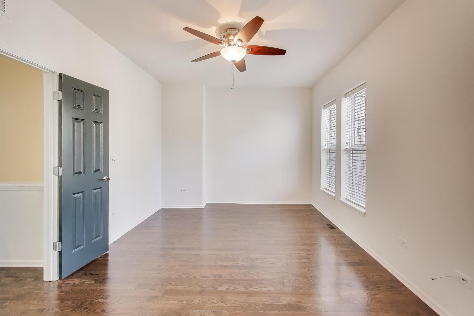513 Grove Lane Forest Park, IL 60130 - Photo 22 of 34 wooden floor in an empty room with a window
