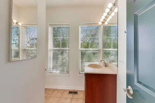 a bathroom with a sink and a window