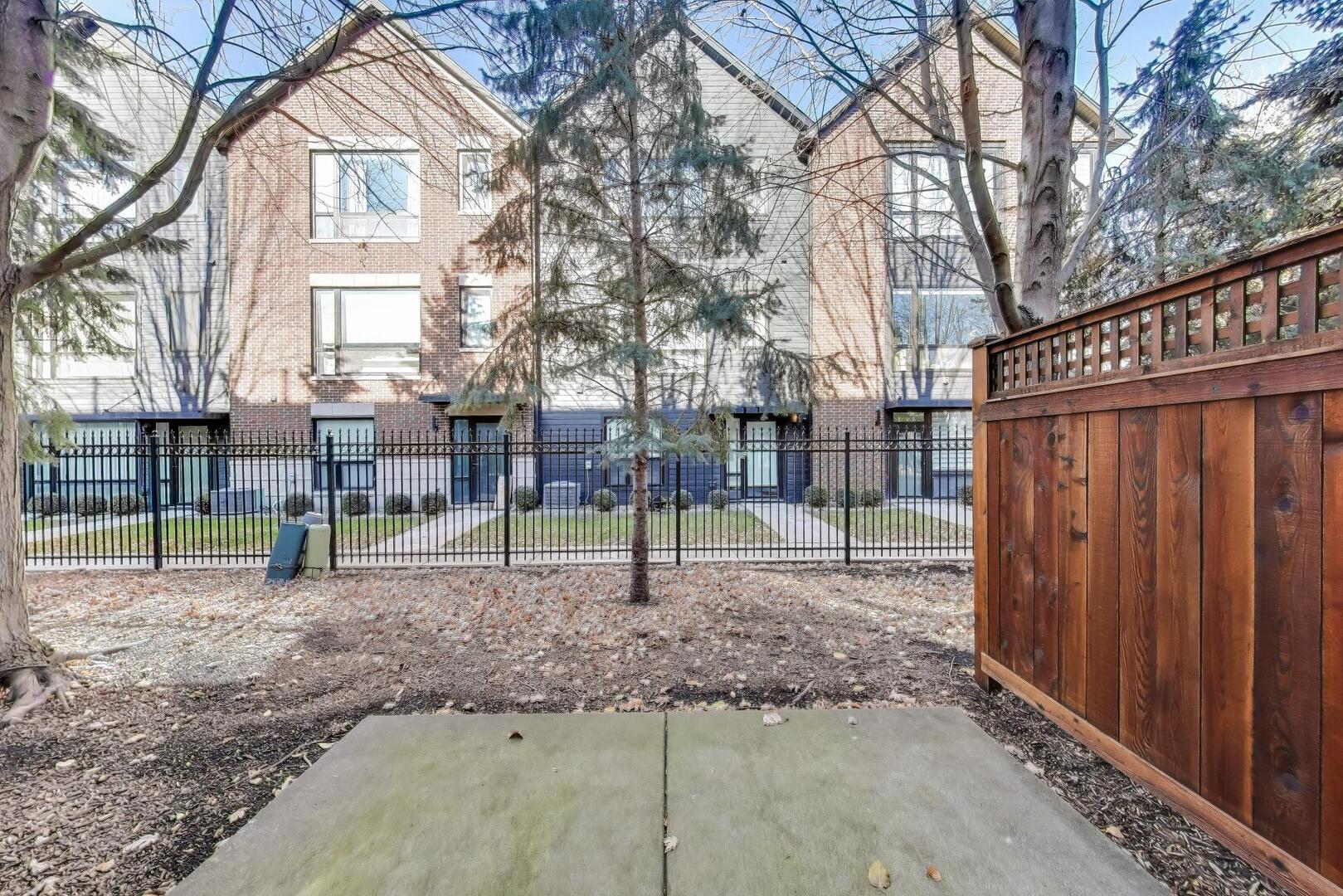 513 Grove Lane Forest Park, IL 60130 - Photo 30 of 34 a view of a backyard with wooden fence