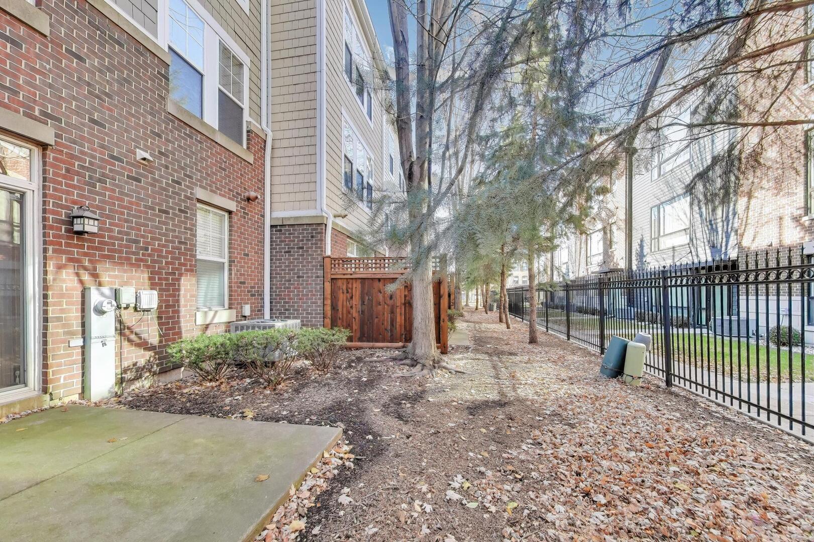 513 Grove Lane Forest Park, IL 60130 - Photo 31 of 34 a view of a backyard with a large tree