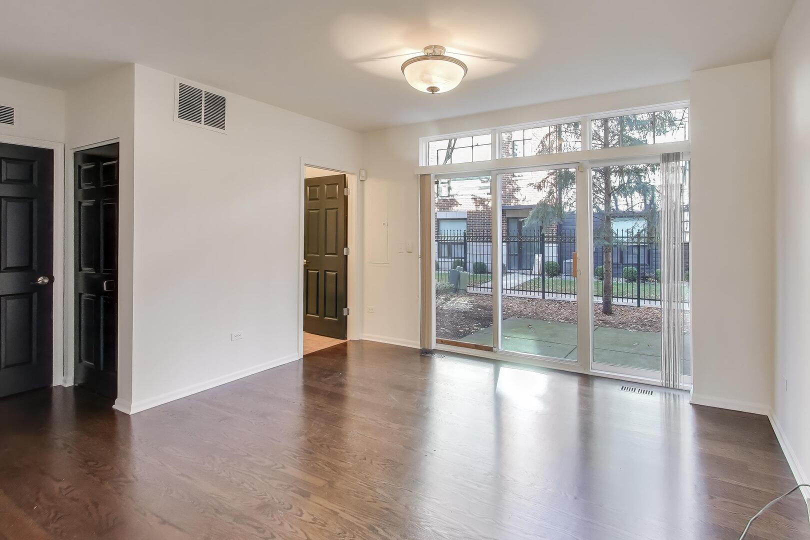 513 Grove Lane Forest Park, IL 60130 - Photo 6 of 34 a view of an entryway with wooden floor