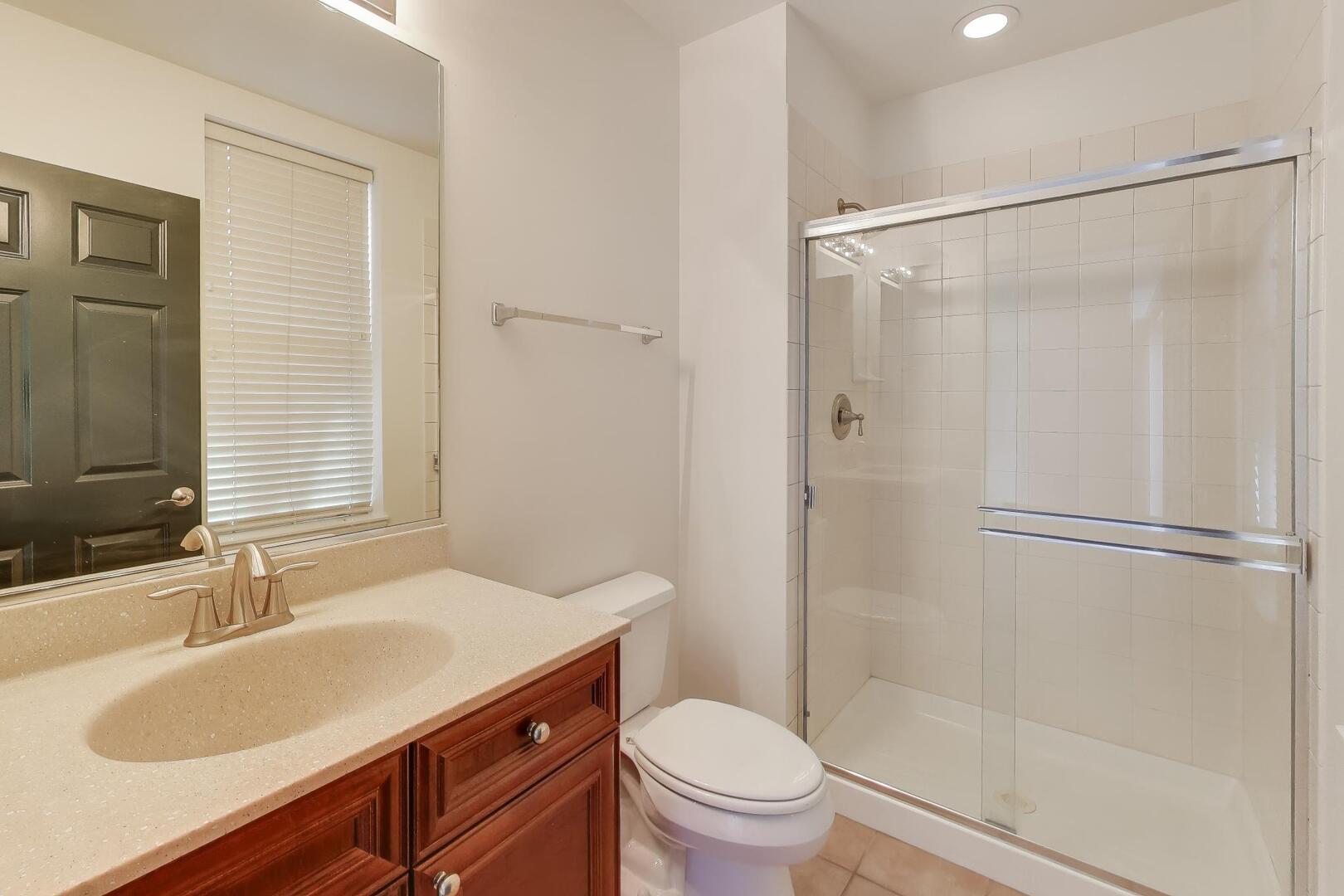 513 Grove Lane Forest Park, IL 60130 - Photo 8 of 34 a bathroom with a sink toilet and shower