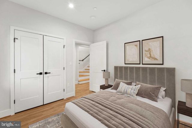 a bedroom with a bed and a mirror