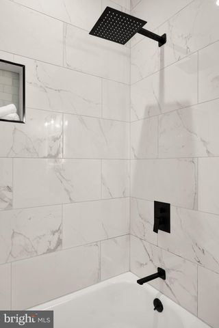 a bathroom with a sink and a shower