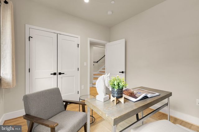 a view of a hallway with washer and dryer