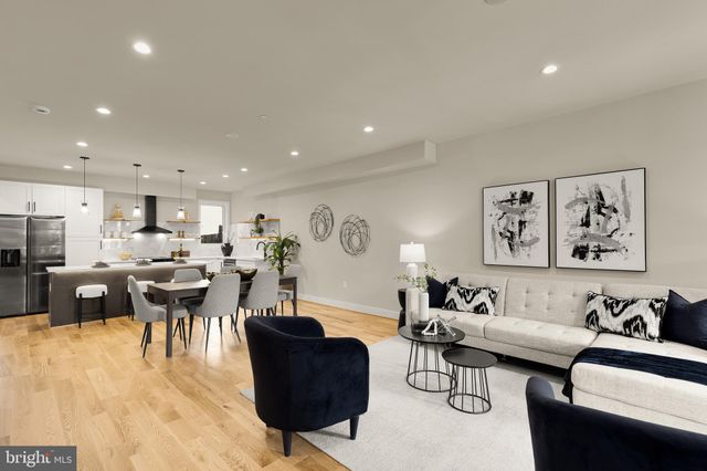 a living room with furniture and a table