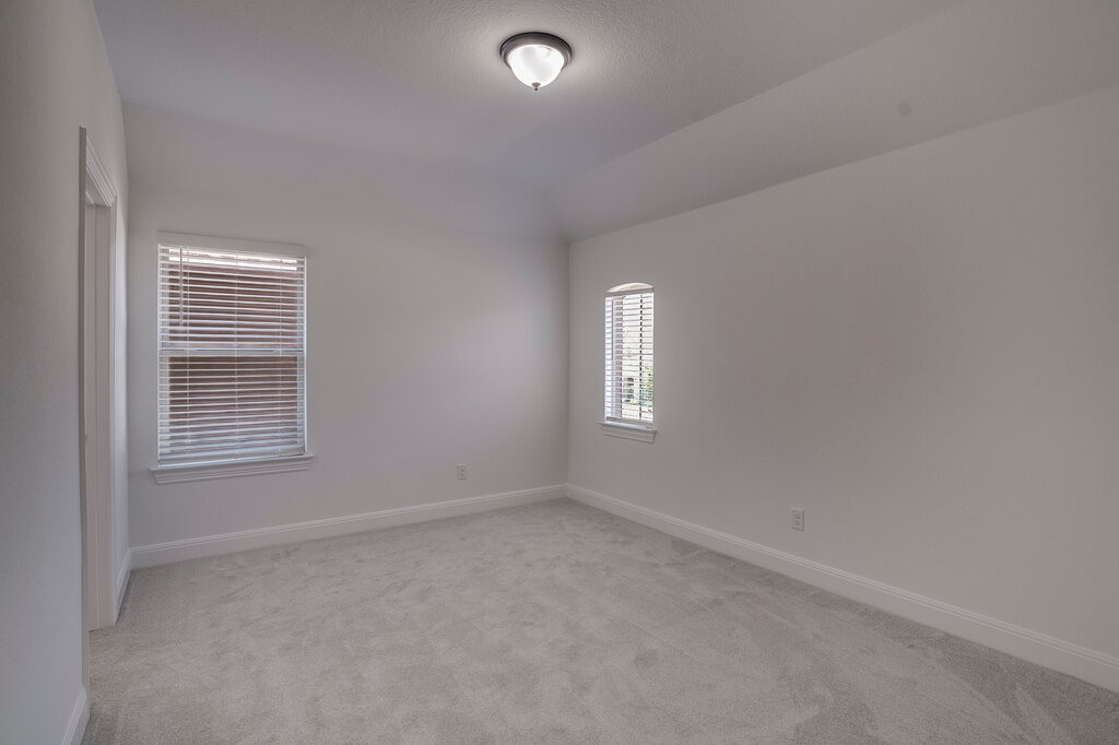 2920 Hadley Way Leander, TX 78641 - Photo 15 of 20 A well-lit, neutral room with fresh carpet and classic window blinds.