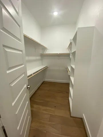 a bathroom with a sink and glass door