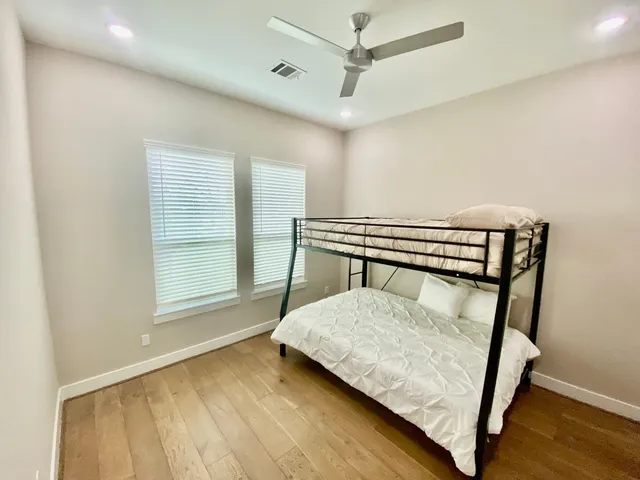 a bedroom with a bed and window