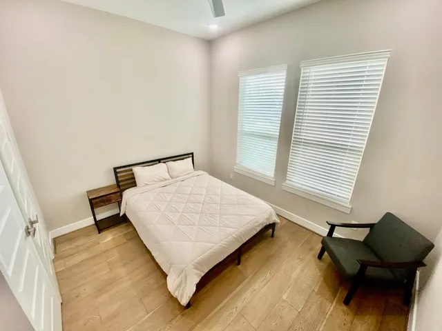a bathroom with a double vanity sink mirror and shower