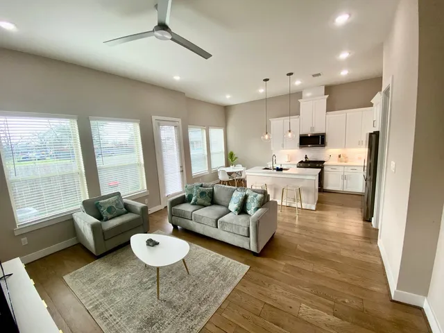 a living room with furniture and a table