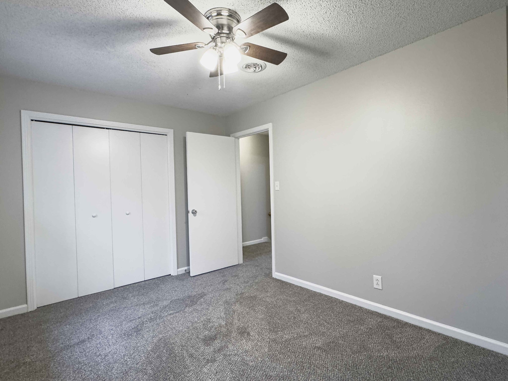 610 Sango Road Clarksville, TN 37043 - Photo 16 of 21 an empty room with a chandelier fan and a chandelier fan