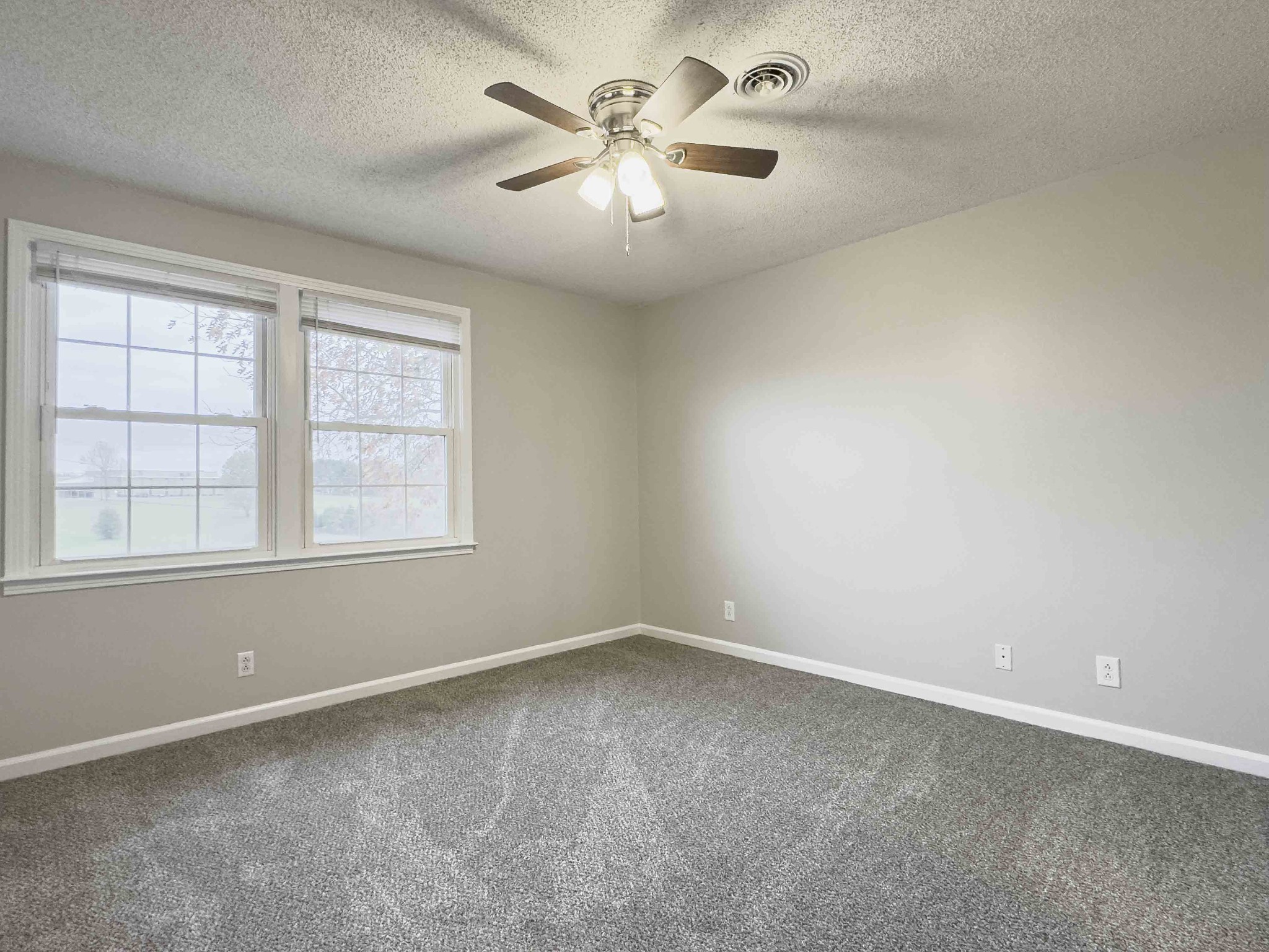 610 Sango Road Clarksville, TN 37043 - Photo 18 of 21 an empty room with windows and fan
