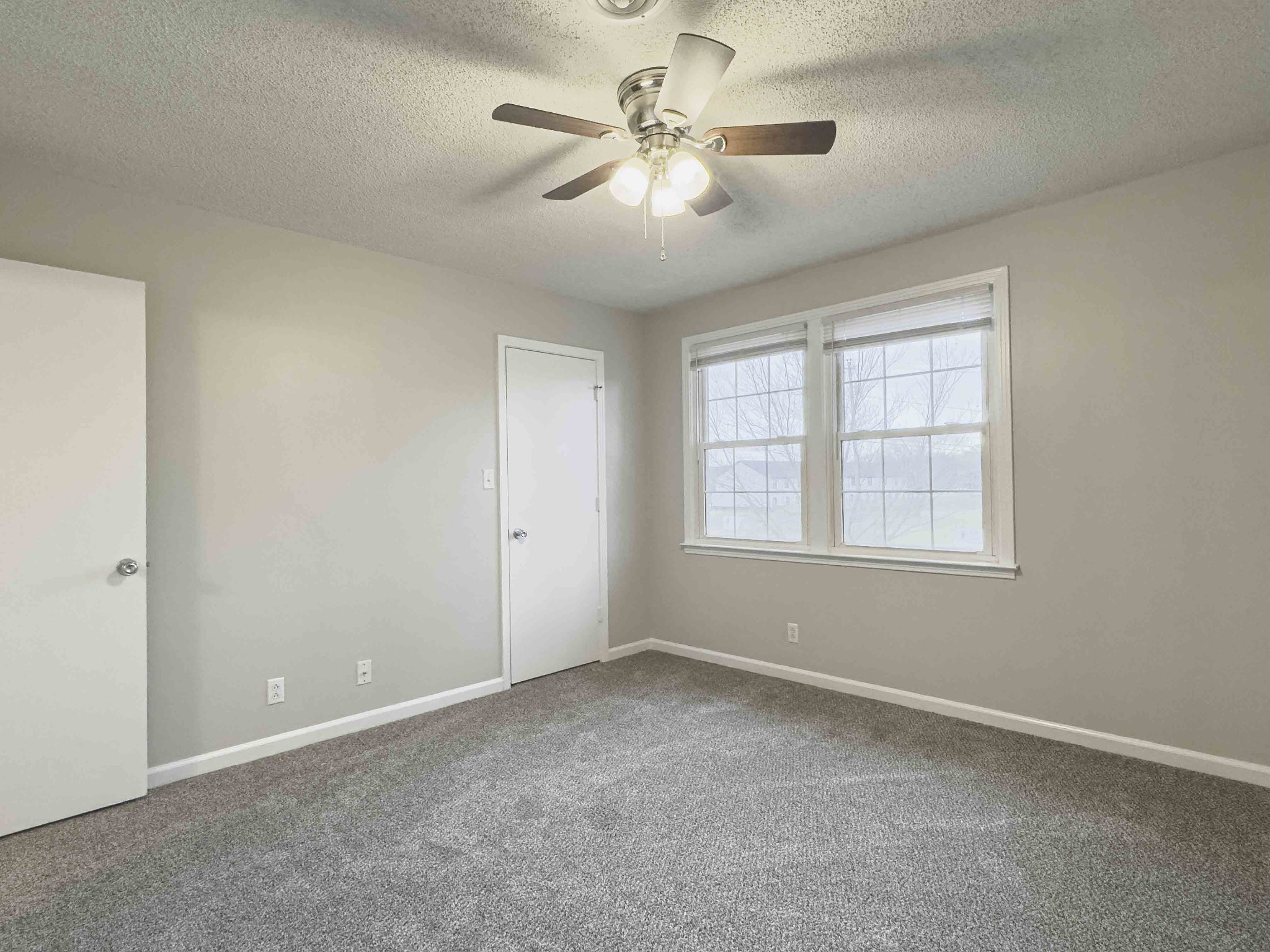 610 Sango Road Clarksville, TN 37043 - Photo 19 of 21 an empty room with windows and fan