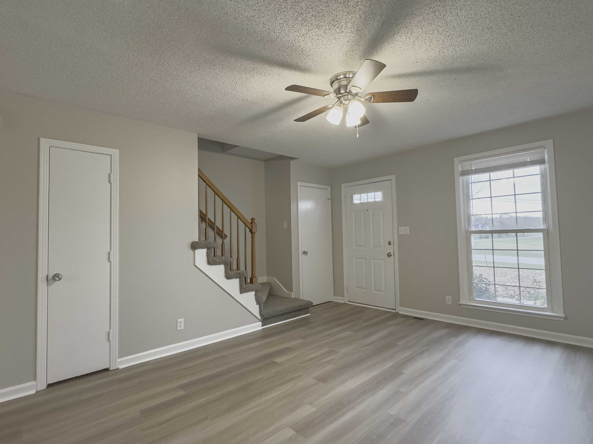 610 Sango Road Clarksville, TN 37043 - Photo 4 of 21 a view of an empty room with wooden floor and a window