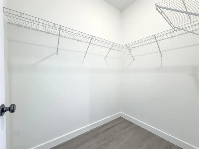 a view of a room with racks on the wall