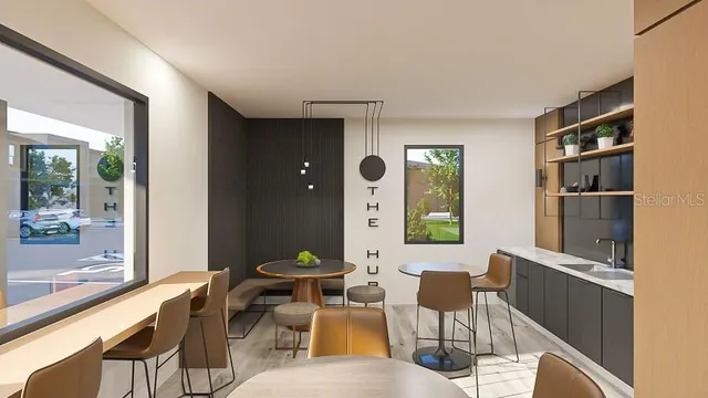 a living room with furniture a window and a table