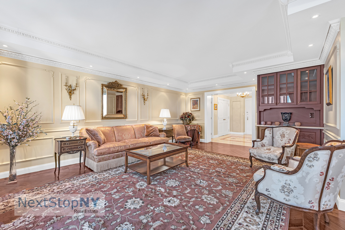 721 5th Avenue, Unit 48K Manhattan, NY 10022 - Photo 2 of 15 a living room with furniture and wooden floor