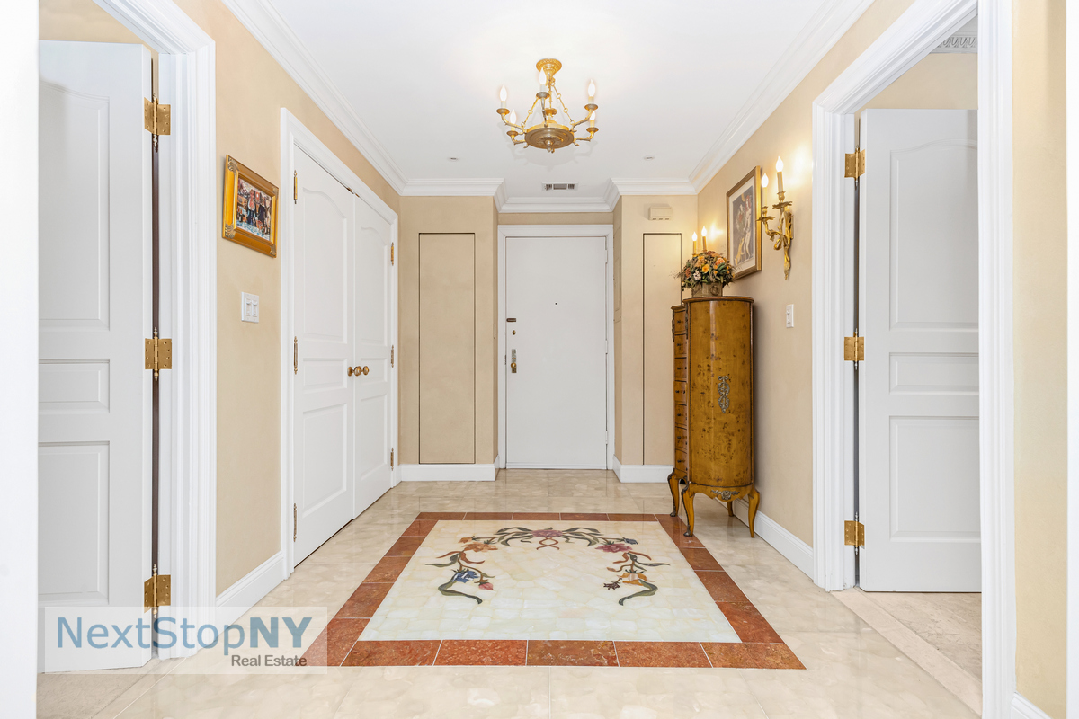 721 5th Avenue, Unit 48K Manhattan, NY 10022 - Photo 6 of 15 a view of a hallway with a living area