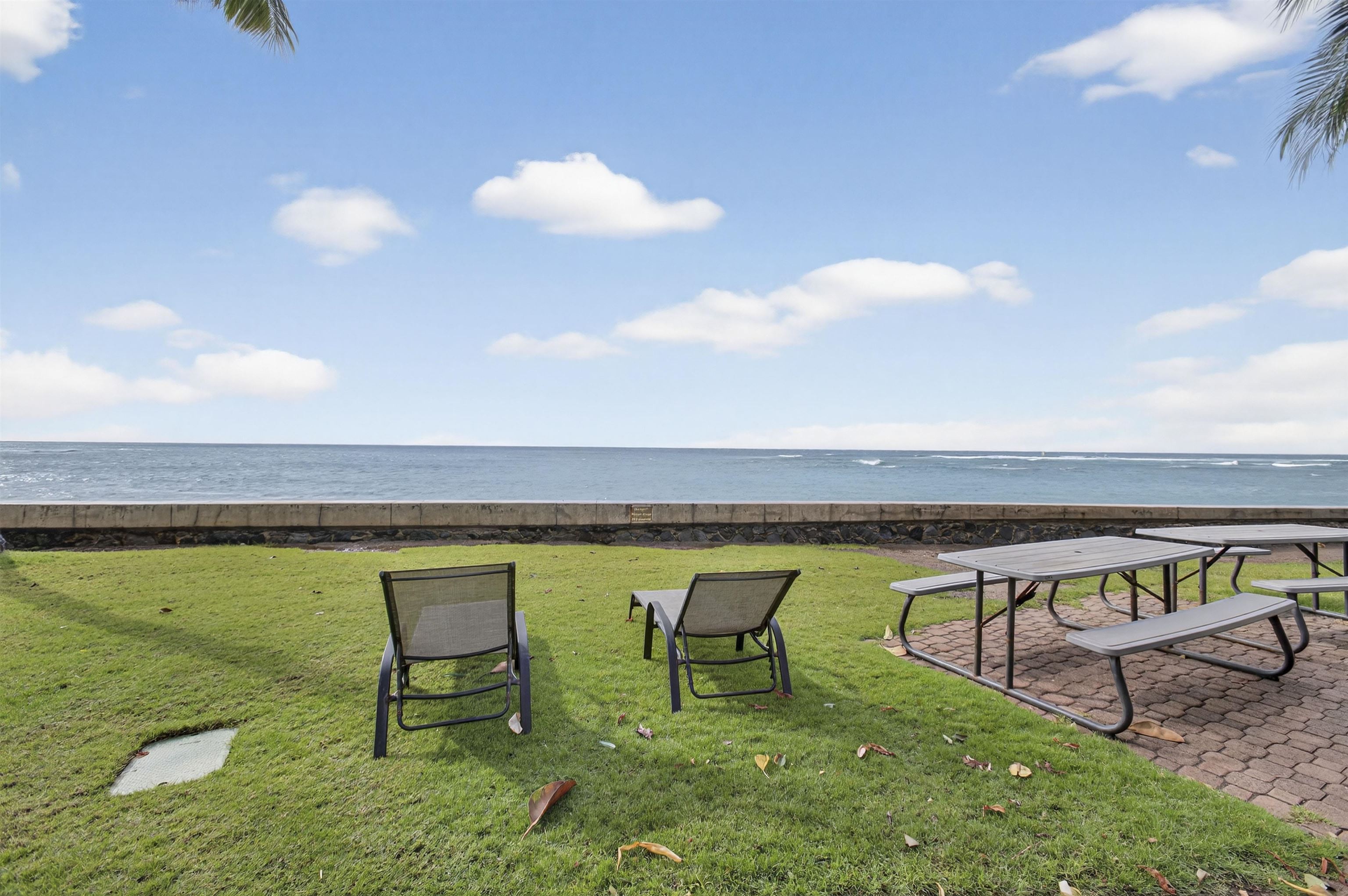 4435 Lower Honoapiilani Road, Unit 111 Lahaina, HI 96761 - Photo 14 of 50 a view of swimming pool with outdoor seating and yard in back