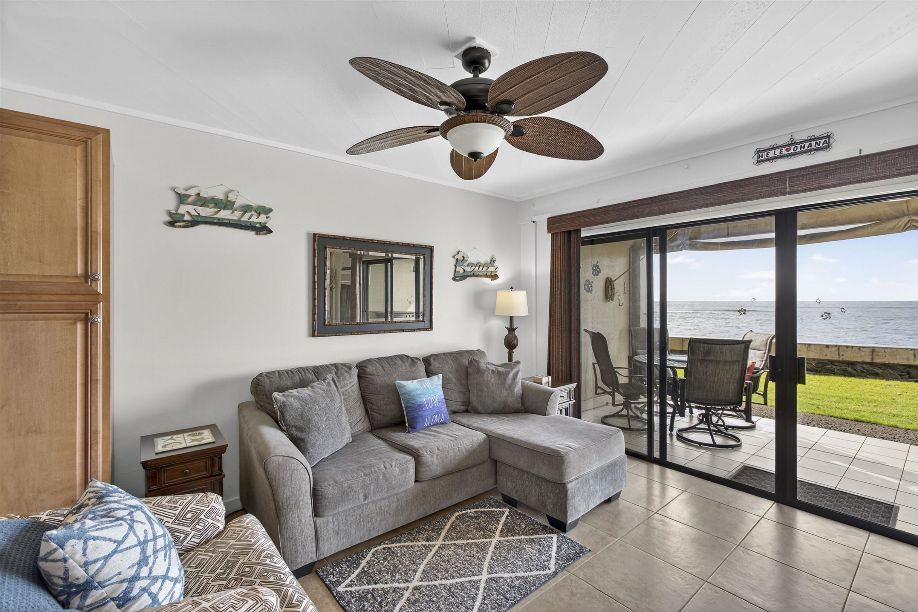 4435 Lower Honoapiilani Road, Unit 111 Lahaina, HI 96761 - Photo 32 of 50 a living room with furniture and a large window