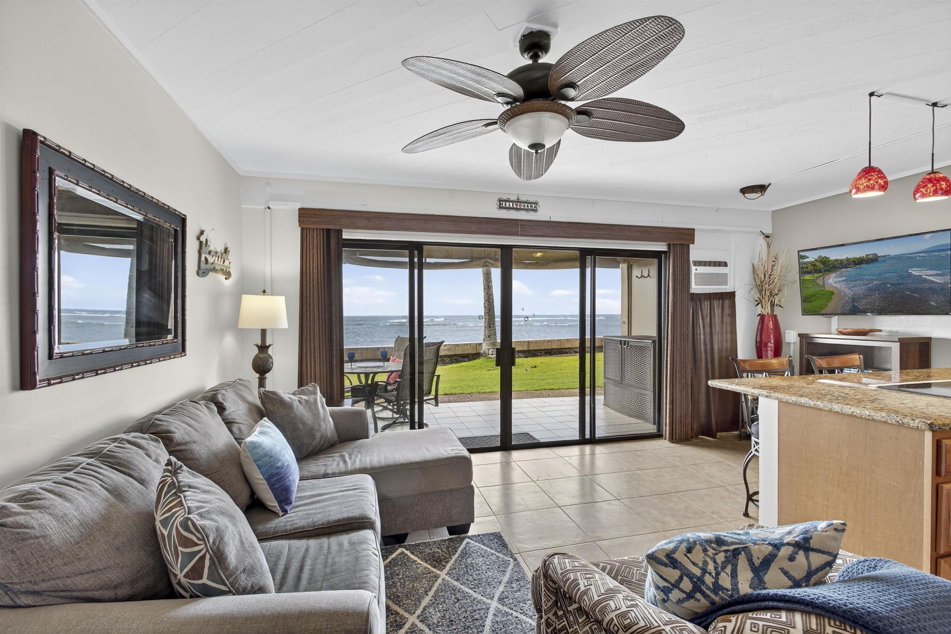 4435 Lower Honoapiilani Road, Unit 111 Lahaina, HI 96761 - Photo 34 of 50 a living room with furniture and a flat screen tv