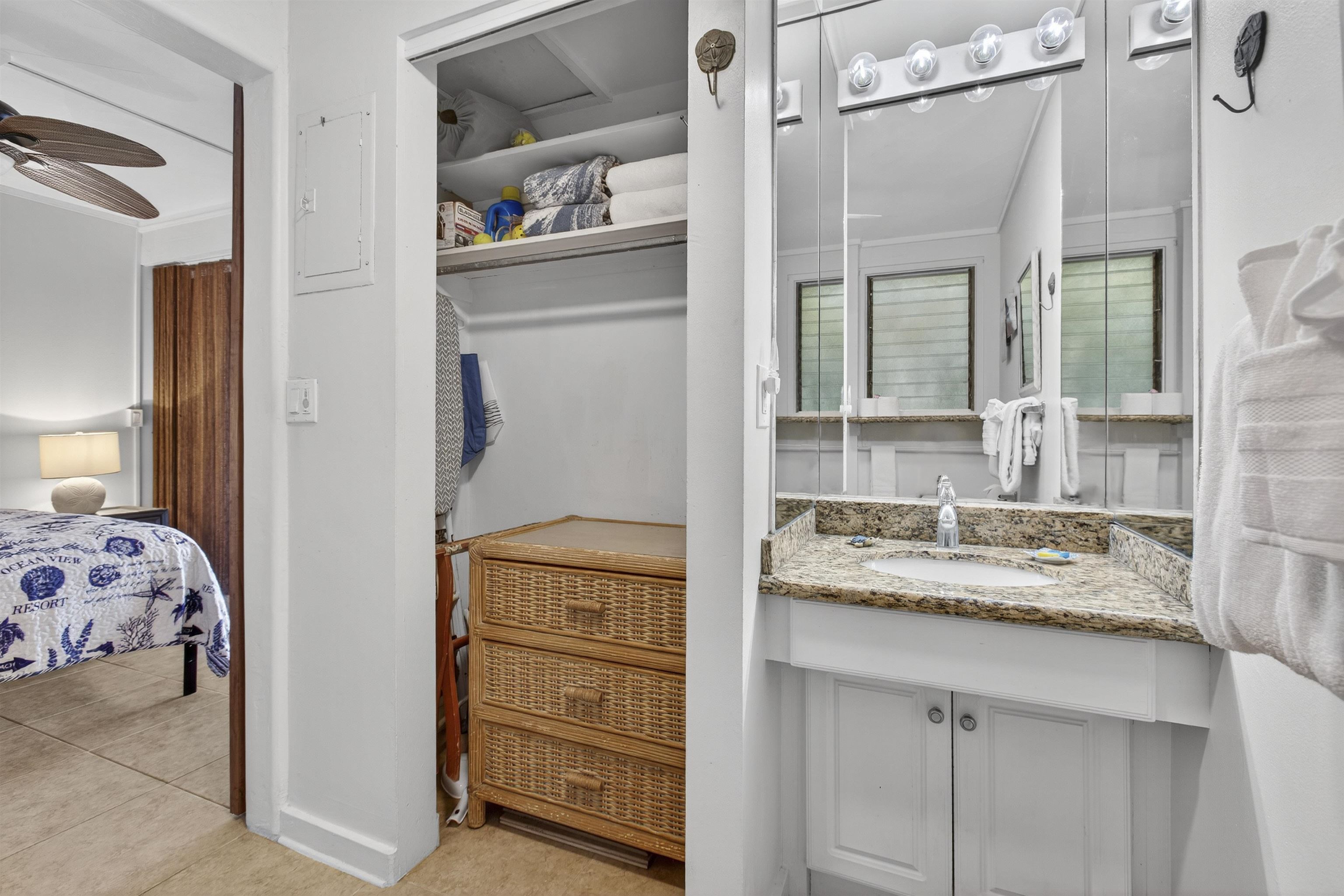 4435 Lower Honoapiilani Road, Unit 111 Lahaina, HI 96761 - Photo 37 of 50 a en suite bathroom with a granite countertop sink and a window