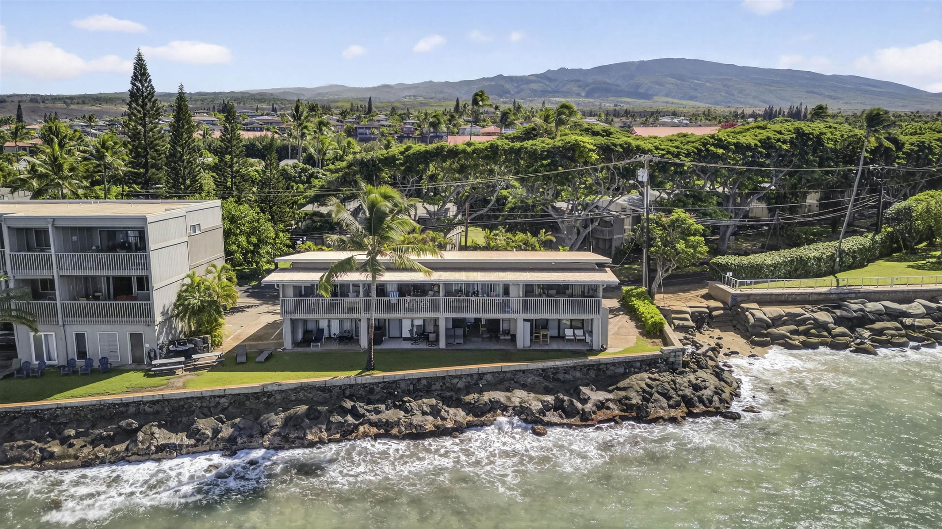 4435 Lower Honoapiilani Road, Unit 111 Lahaina, HI 96761 - Photo 6 of 50 a view of a house with a yard and sitting area