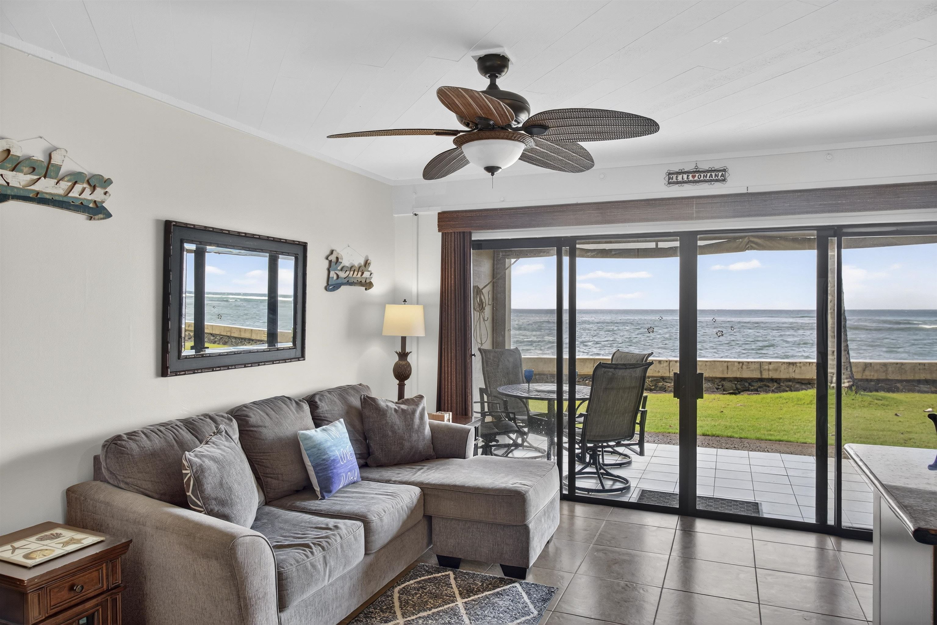 4435 Lower Honoapiilani Road, Unit 111 Lahaina, HI 96761 - Photo 10 of 50 a living room with furniture and a large window