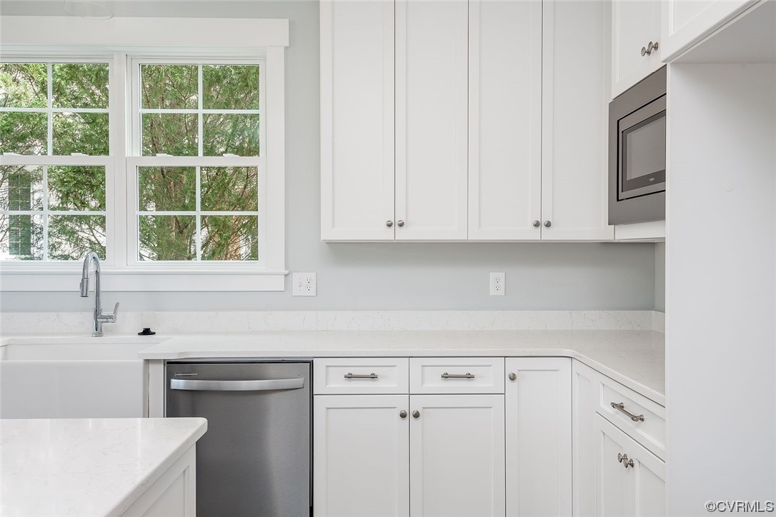 3154 Cider House Road Toano, VA 23168 - Photo 11 of 36 a kitchen with stainless steel appliances white cabinets and a sink