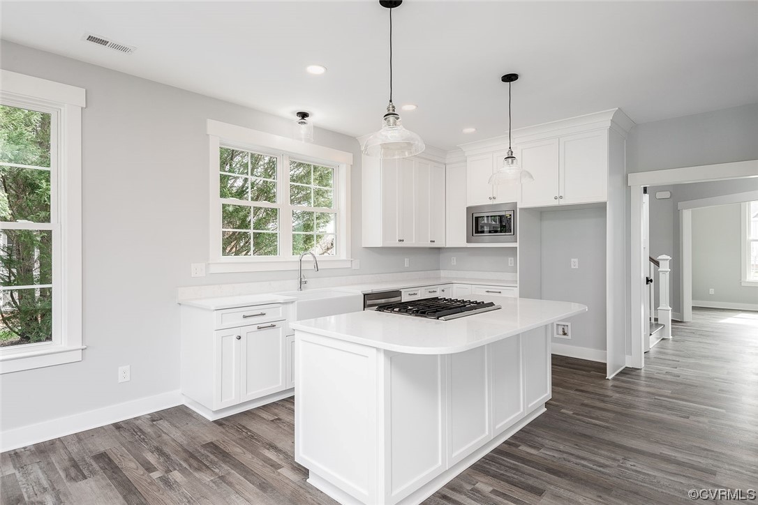 3154 Cider House Road Toano, VA 23168 - Photo 16 of 36 a kitchen with stainless steel appliances granite countertop a stove a sink dishwasher and a refrigerator with wooden floor
