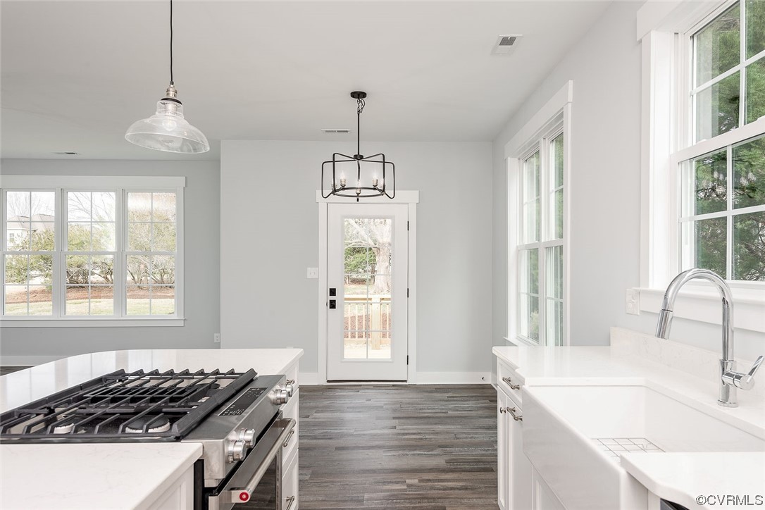 3154 Cider House Road Toano, VA 23168 - Photo 17 of 36 a kitchen that has a sink stove and window
