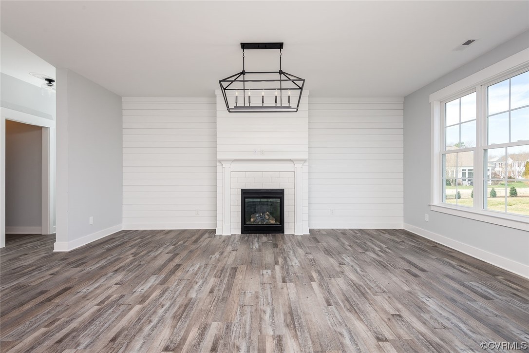 3154 Cider House Road Toano, VA 23168 - Photo 19 of 36 wooden floor fireplace and windows in an empty room