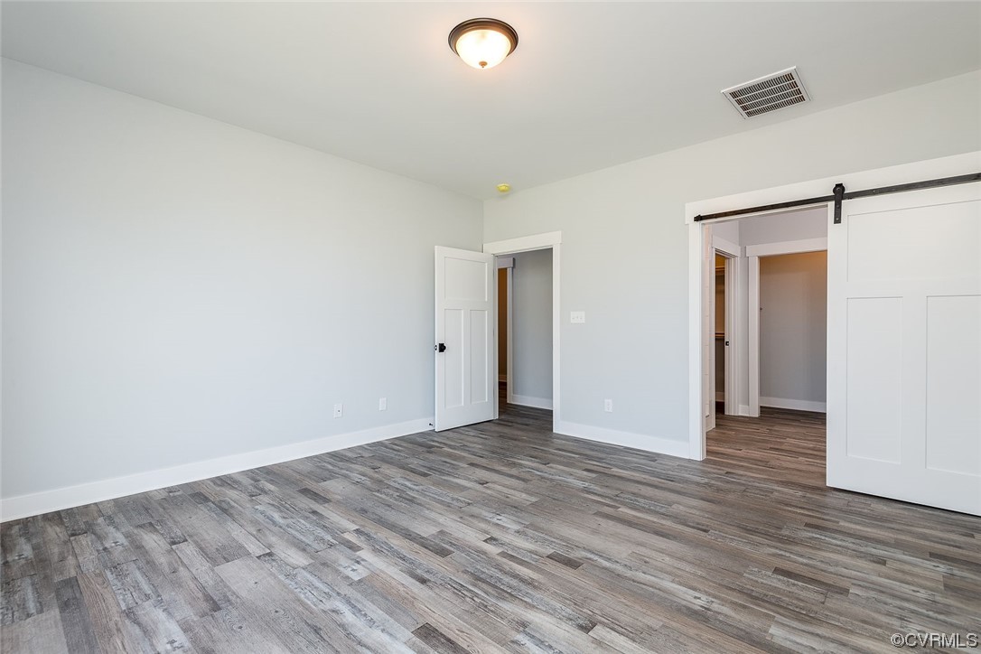 3154 Cider House Road Toano, VA 23168 - Photo 22 of 36 a view of an empty room with wooden floor and closet