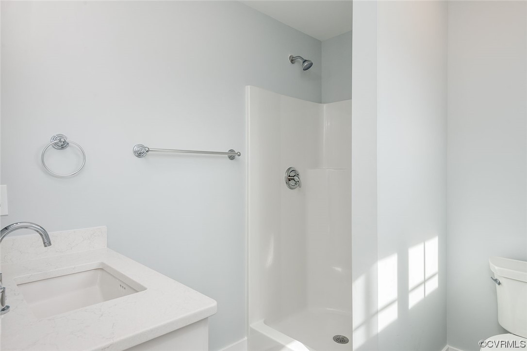 3154 Cider House Road Toano, VA 23168 - Photo 29 of 36 a bathroom with a sink and toilet