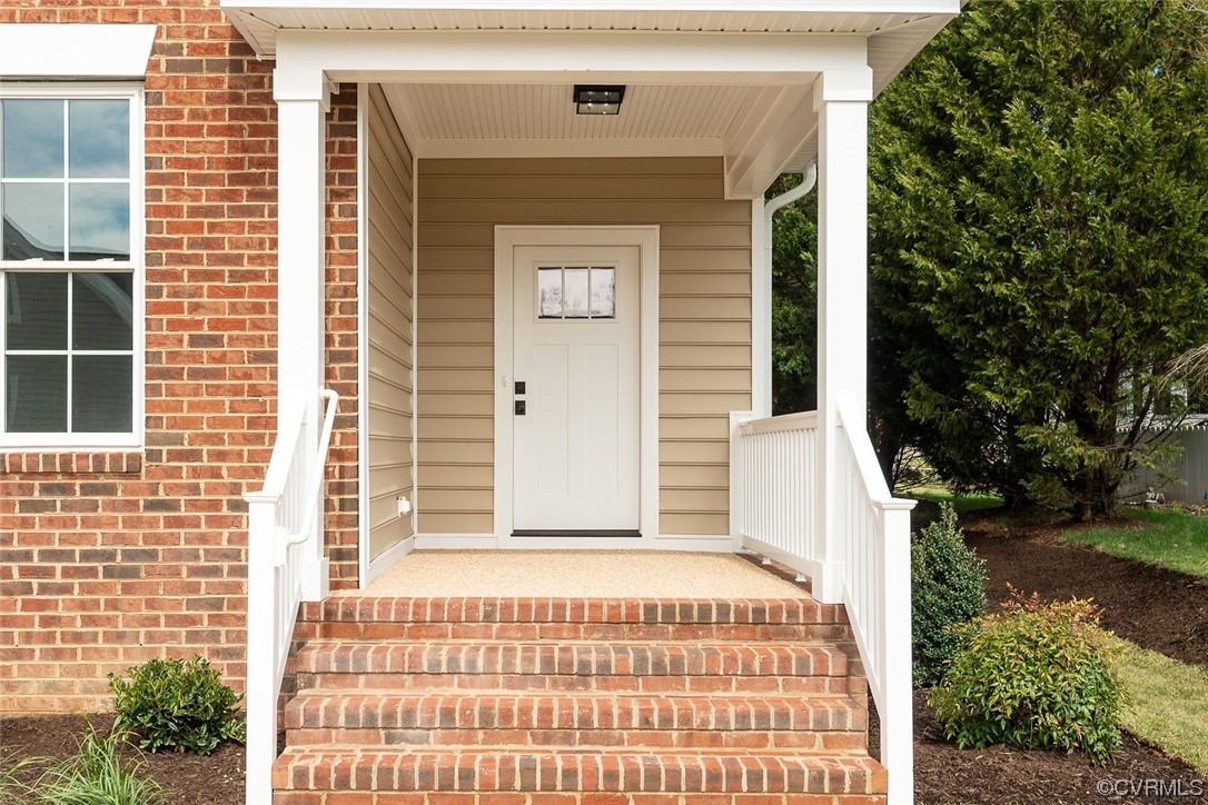 3154 Cider House Road Toano, VA 23168 - Photo 5 of 36 a front view of a house with a garden