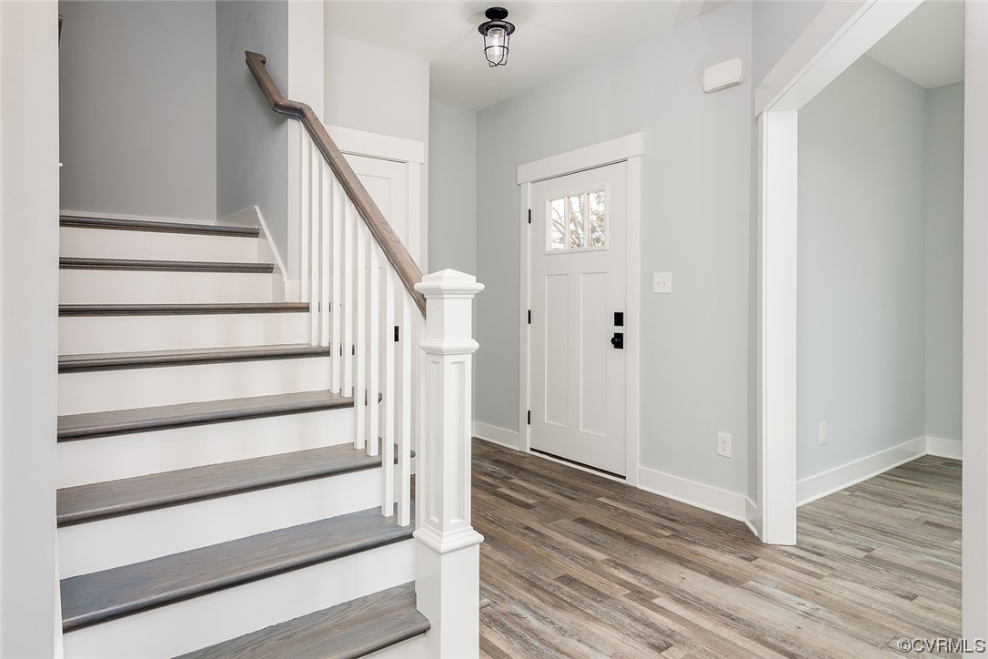 3154 Cider House Road Toano, VA 23168 - Photo 9 of 36 a view of entryway with wooden floor and stairs