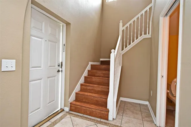 a view of entryway with wooden floor and door