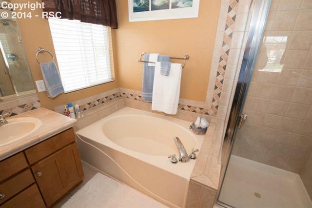 207 Talus Road Monument, CO 80132 - Photo 11 of 19 5 Piece Master Bath with Tile Floor