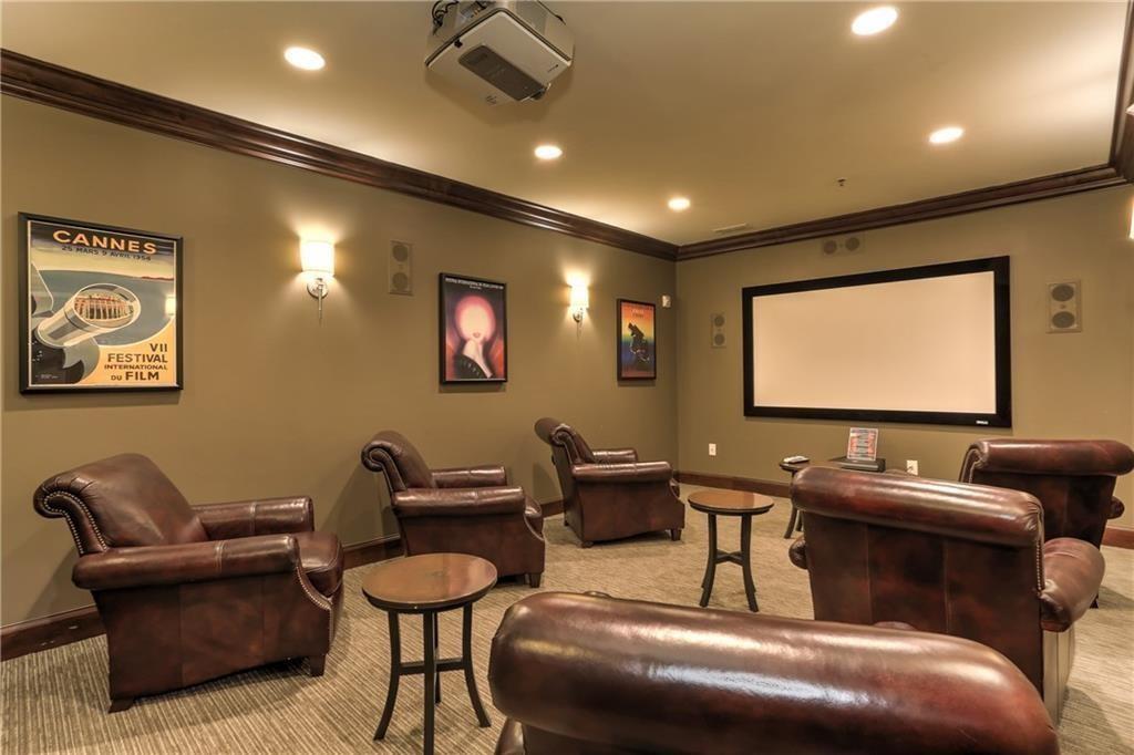 901 Abernathy Road Northeast, Unit 2110 Sandy Springs, GA 30328 - Photo 29 of 29 a room with furniture projector and screen