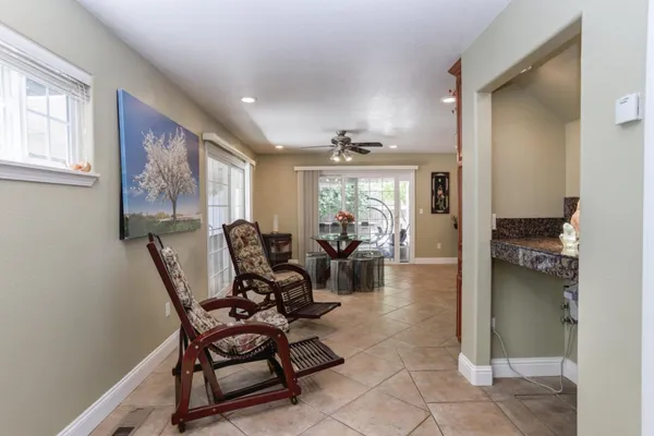 a living room with furniture and a potted plant