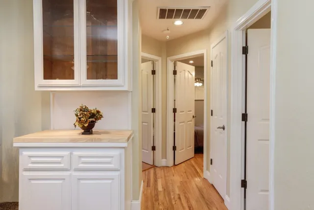 a bathroom with a sink vanity and a mirror