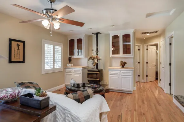 a living room with furniture and fireplace