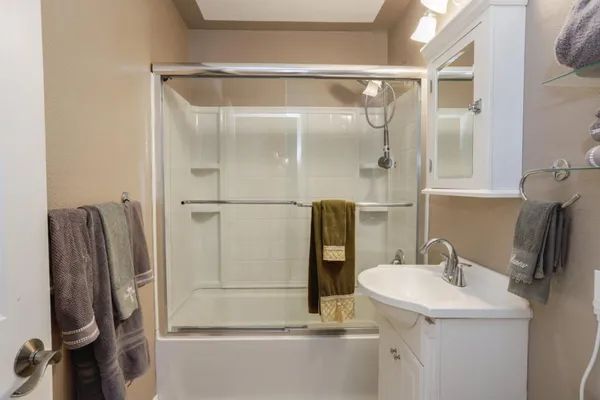a bathroom with a sink and mirror